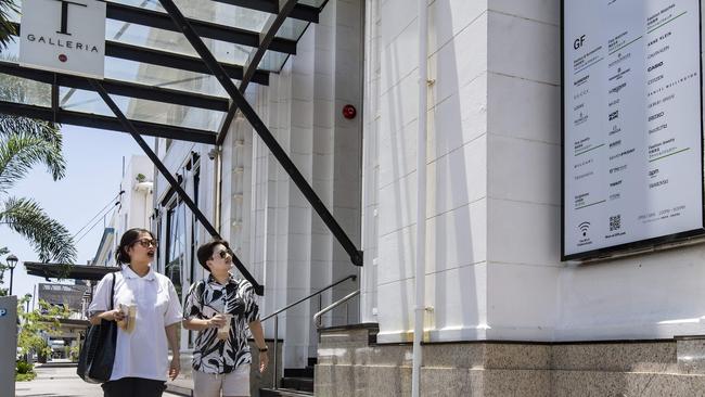 Monica Liu and Palm Khampookaew walk past the soon to be reopened T Galleria on Abbott St. Picture: Brian Cassey