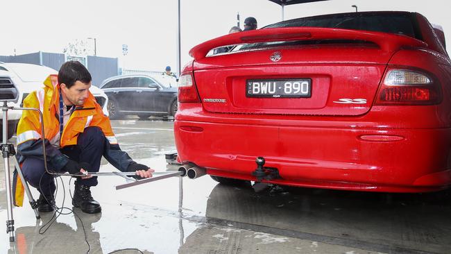 An officer conducts a roadworthy check and defect inspection. Picture: Brendan Beckett