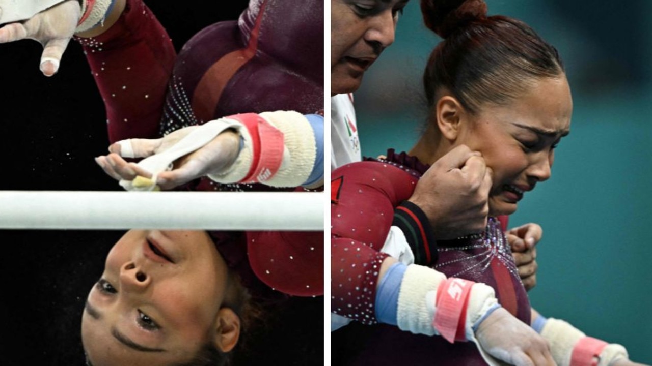 Mexico's Natalia Escalera is assisted by her coach after competing in the uneven bars event. (Photo by Lionel BONAVENTURE / AFP)