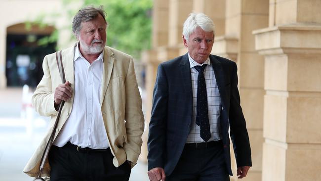 Defence barrister Bill Boucaut SC, left, and prosecutor Tim Preston, right, outside court. Picture: Dylan Coker.