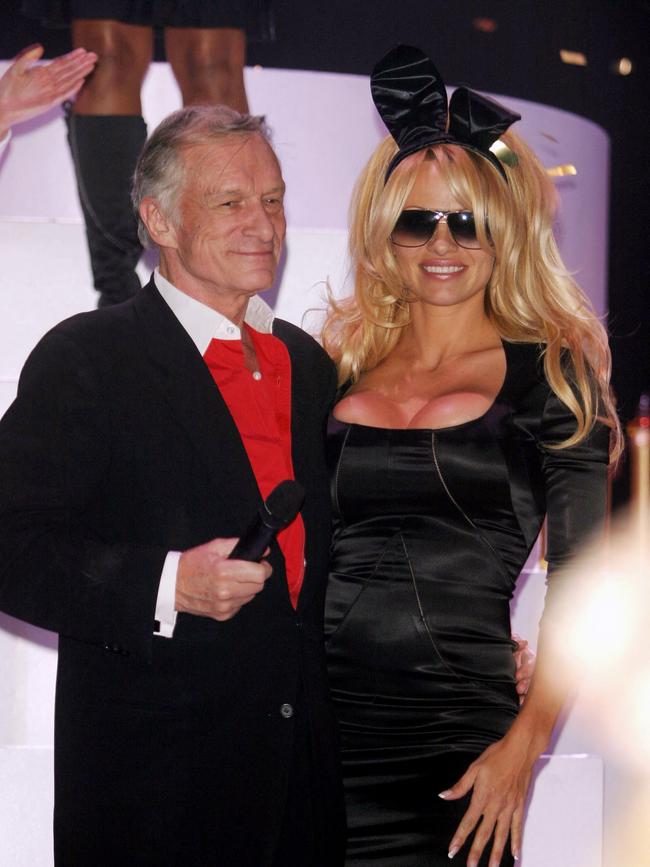 Pamela Anderson and Hugh Hefner at the Playboy 50th Anniversary celebration.