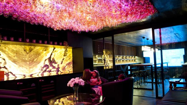 Statement lighting in the incredible space, which includes a wine cellar.