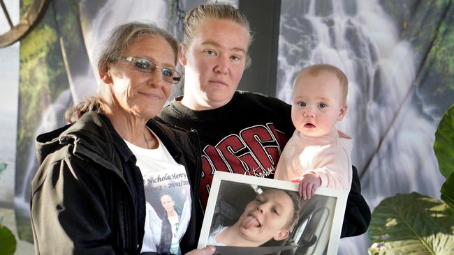 Karen, Taylor and Addison with a picture of Nicholas Henry. Picture Dean Martin