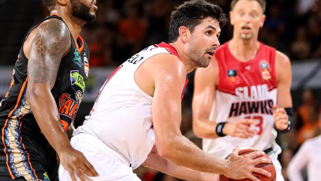 Taipans DJ Newbill runs into Hawks Todd Blanchfield during the Round 6 NBL match between Cairns Taipans and Illawarra Hawks at the Cairns Convention Centre in Cairns, Saturday, November 9, 2019. (AAP Image/Marc McCormack)