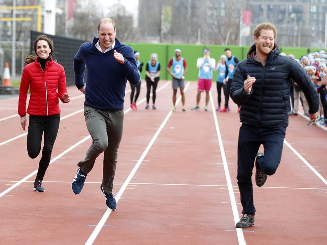 The two princes get competitive as William strays into Kate’s lane. Picture: AP Photo/Alastair Grant