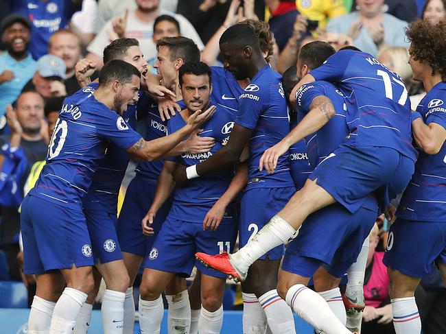 Chelsea's Pedro, centre, celebrates with teammates after scoring his side's first goal. Picture: AP Photo