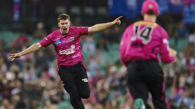 SYDNEY, AUSTRALIA - DECEMBER 28: Hayden Kerr of the Sixers celebrates after taking the wicket of Shaun Marsh of the Renegades during the Men's Big Bash League match between the Sydney Sixers and the Melbourne Renegades at Sydney Cricket Ground, on December 28, 2022, in Sydney, Australia. (Photo by Brett Hemmings/Getty Images)