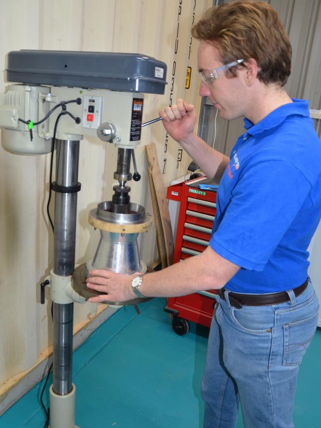 Black Sky Aerospace engineer Mitch Shaw working on a rocket nozzle ready for the weekend launch. Picture: Supplied