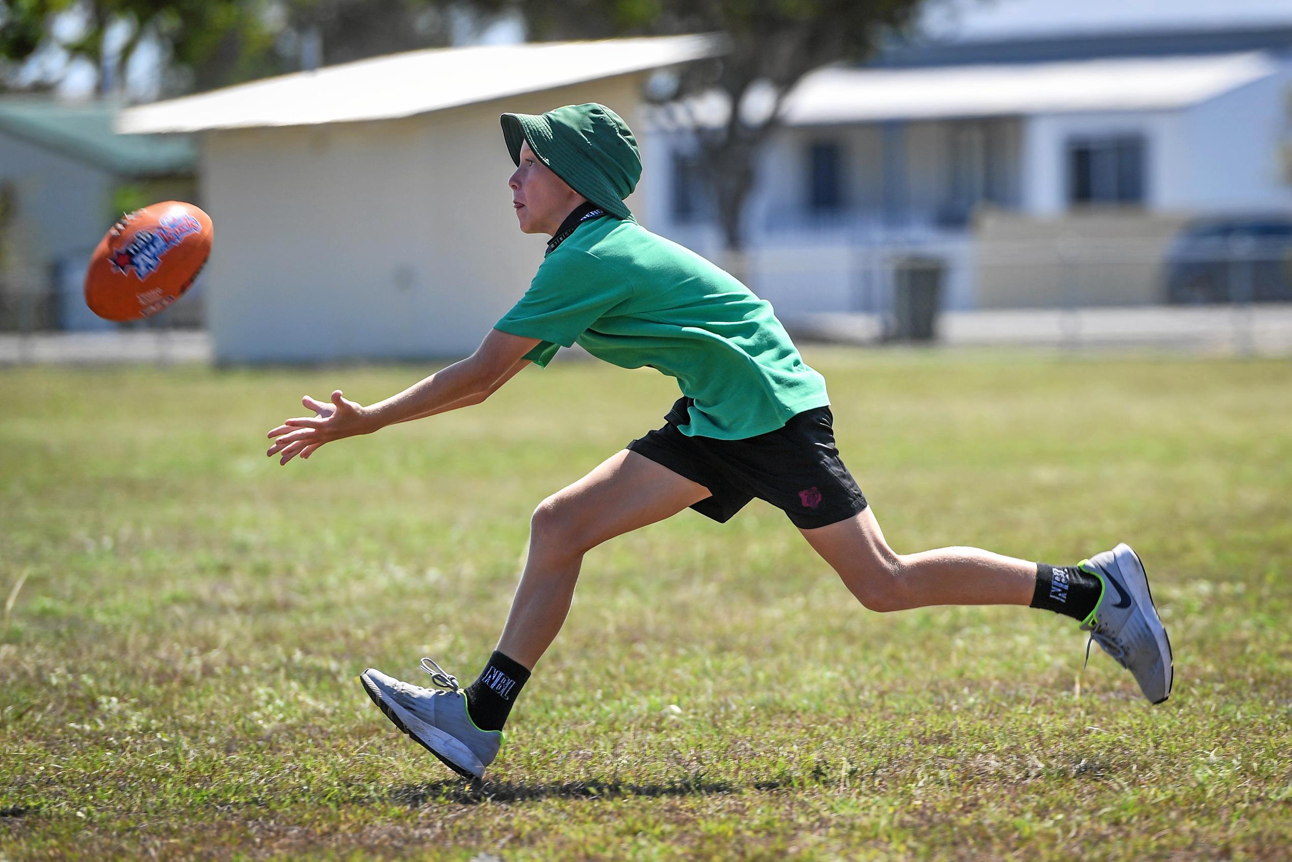 Jayce DeSilva making ground to take a mark. Picture: Brian Cassidy