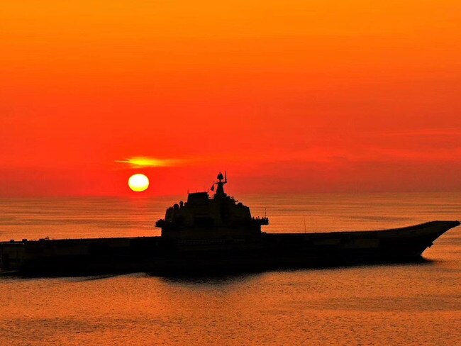 China's aircraft carrier Liaoning at sunset. A second carrier is about to enter service and a third is under construction. Picture: Xinhua.