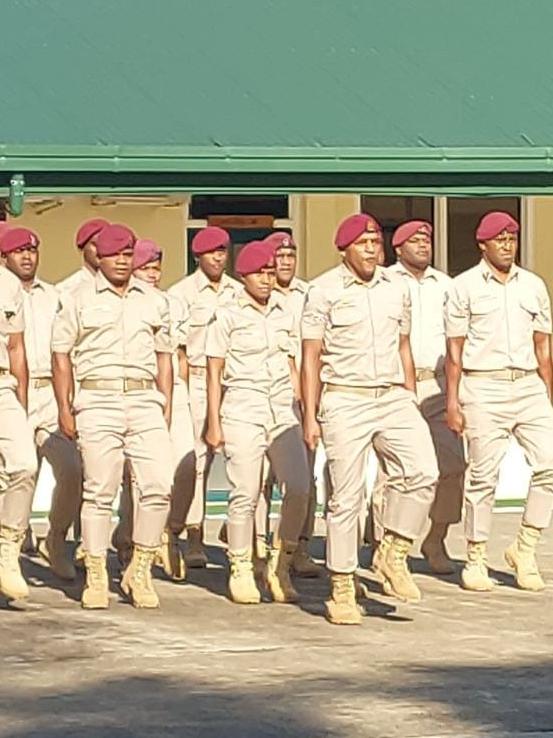 Fiji prison officers marching.