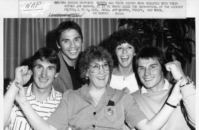 Brother Guy, Dean, mum Joy, sister Tracy and Troy posing to celebrating reuniting after being separated from Joy for 20 years.