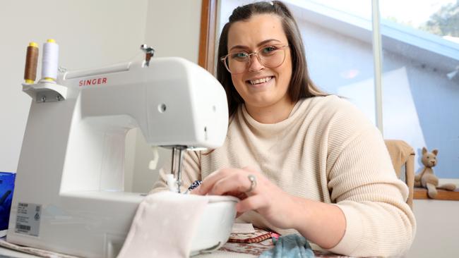 Central Coast nurse Amiee Hegarty sews face masks, scrunchies and headbands as a gift for her colleagues at Gosford Hospital. Picture: David Swift