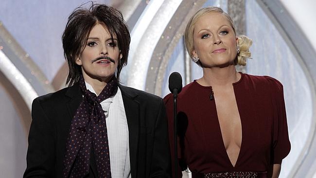 Tina Fey, left, and Amy Poehler on stage during the 70th Annual Golden Globe Awards at the Beverly Hilton Hotel on Jan. 13, 2013.