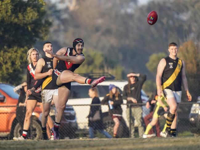 Devon Meadows captain Joel Hillis kicks. Picture: Valeriu Campan