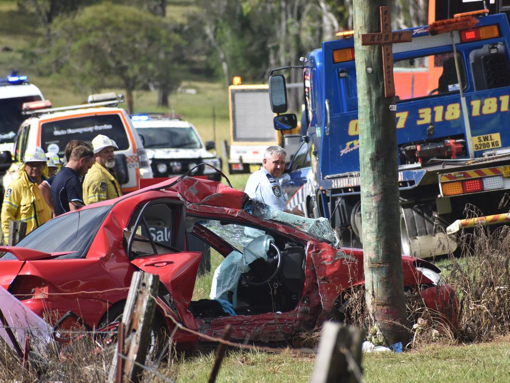 Multiple emergency services crews attended the scene after a red sedan Mitsubishi Lancer sedan crashed into a power pole on Rogans Bridge Rd north of Waterview Heights on Thursday, 18th February, 2021. Photo Bill North / The Daily Examiner