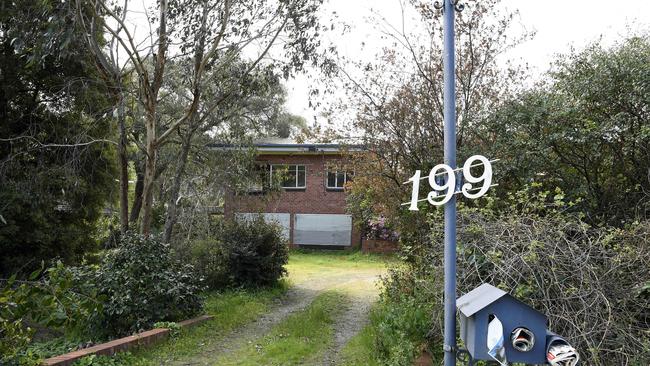 199 Canterbury Rd remains boarded up after “druggies” allegedly took over the property. Picture: Andy Brownbill