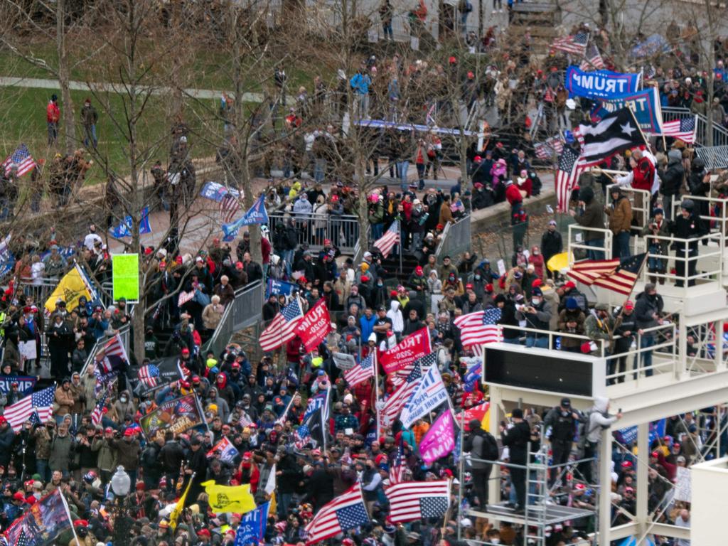 Supporters of US President Donald Trump take over stands set up for the presidential inauguration as they protest at the US Capitol. Picture: AFP