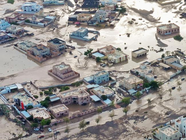 An aerial view shows the aftermath of tropical Cyclone Shaheen in al-Khaburah city of al-Batinah region on October 4, 2021. - At least 11 people died after a powerful cyclone struck Oman causing widespread flooding and landslides, emergency authorities said. Seven of the victims died in the Batinah region, the National Committee for Emergency Management said without giving details. More people are missing, it added. (Photo by Haitham AL-SHUKAIRI / AFP)