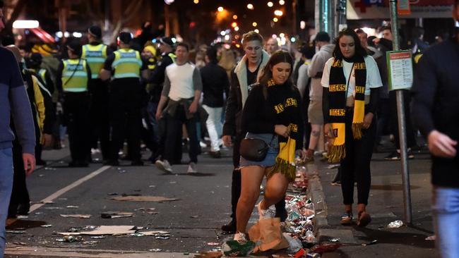 Trash on Swan Street as revellers head home. Picture: Tony Gough