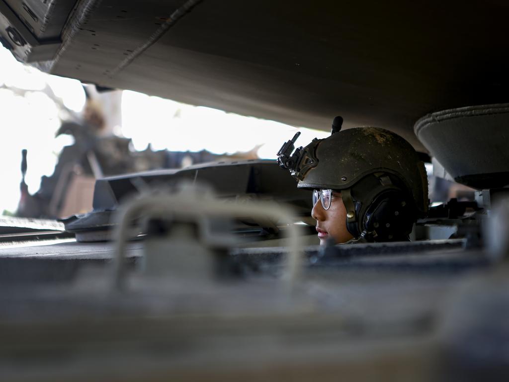 An Australian Army soldier from 2nd Cavalry Regiment drives an M1A2 Abrams Tank into it's new home at Lavarack Barracks, Townsville on 14 November 2024.PHOTO: CPL Guy Sadler