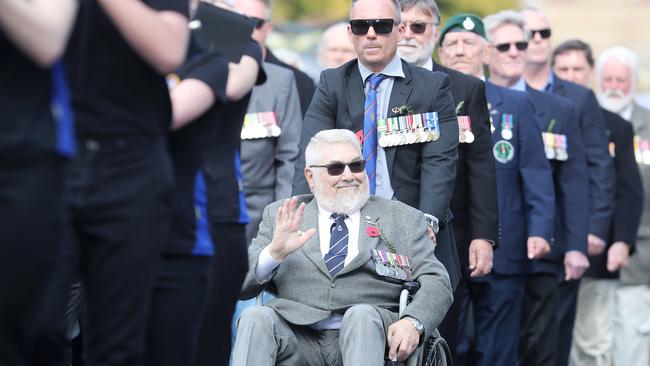 Navy veteran Herman van der Hoek marching with his grandson at the Anzac Day march and service in Hobart. Picture: LUKE BOWDEN