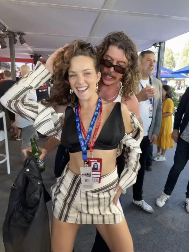 Abbie Chatfield with Peking Duk's Adam Hyde at the Melbourne Grand Prix.