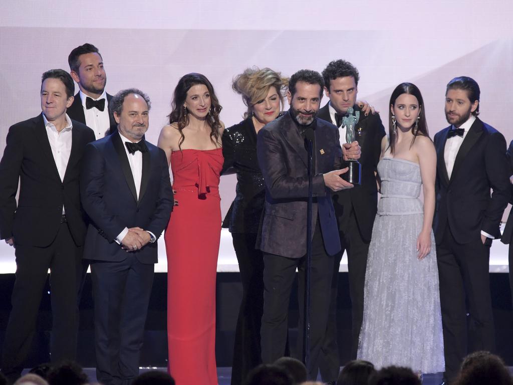 Tony Shalhoub, center, and the cast and crew of The Marvelous Mrs. Maisel, accept the award for outstanding performance by an ensemble in a comedy series at the 25th annual Screen Actors Guild Awards. Picture: AP