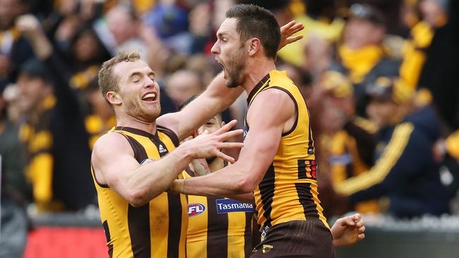 Jack Gunston celebrates another major with Tom Mitchell. Pic: Michael Klein