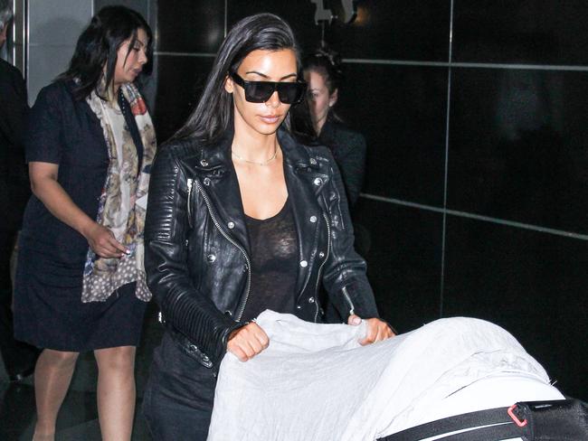 Another day, another ‘do. Kim Kardashian arrives at JFK just hours before going blonde.