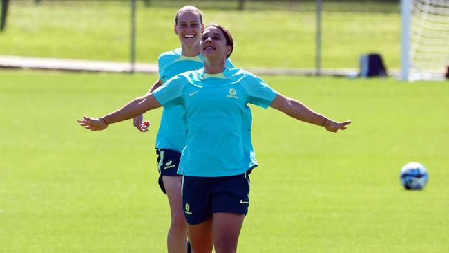 Sam Kerr and Emily van Egmond, behind, during the Matildas Training session in Brisbane. Picture: NCA NewsWire/Tertius Pickard