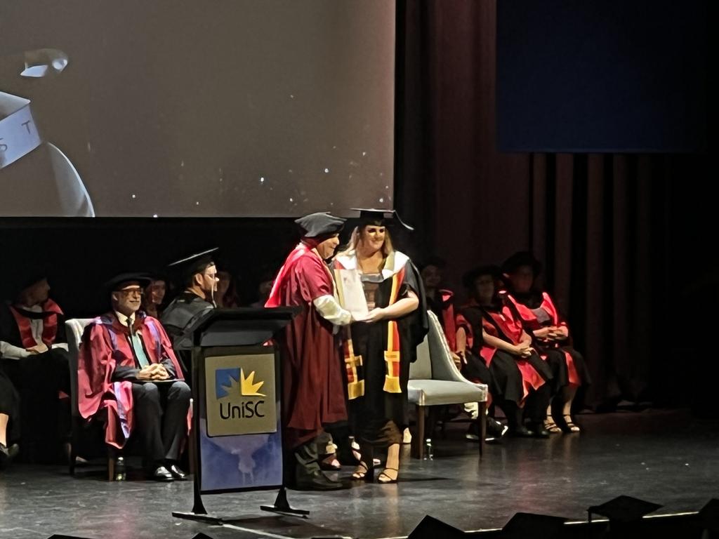 Graduates from the University of the Sunshine Coast's Fraser Coast campus celebrating at the Brolga Theatre.