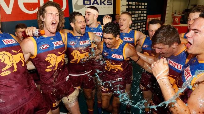 Brisbane players celebrate their first win of the 2018 season. Picture: Getty Images