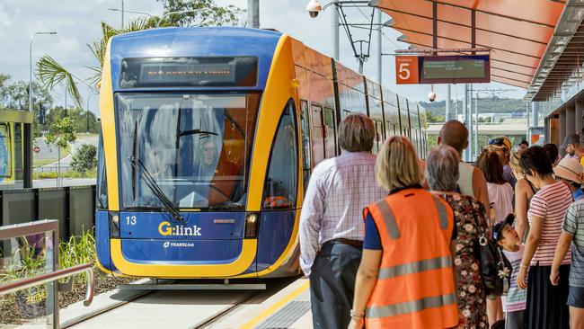 Opening morning of the Stage 2 of the Gold Coast light rail (g:link). The crowds wait as the light rail tram enters the station at Helensvale. Picture: Jerad Williams