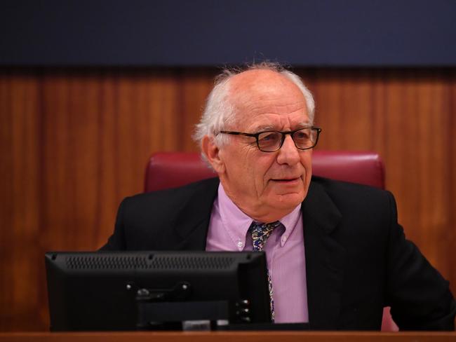 Commissioner Hon. Raymond Finkelstein AO QC is seen during Victoria's royal commission into Crown Casino, in Melbourne, Wednesday, March 24, 2021. The inquiry will look at whether Crown has broken the law and if it is suitable to hold a gaming licence in Victoria. (AAP Image/James Ross) NO ARCHIVING