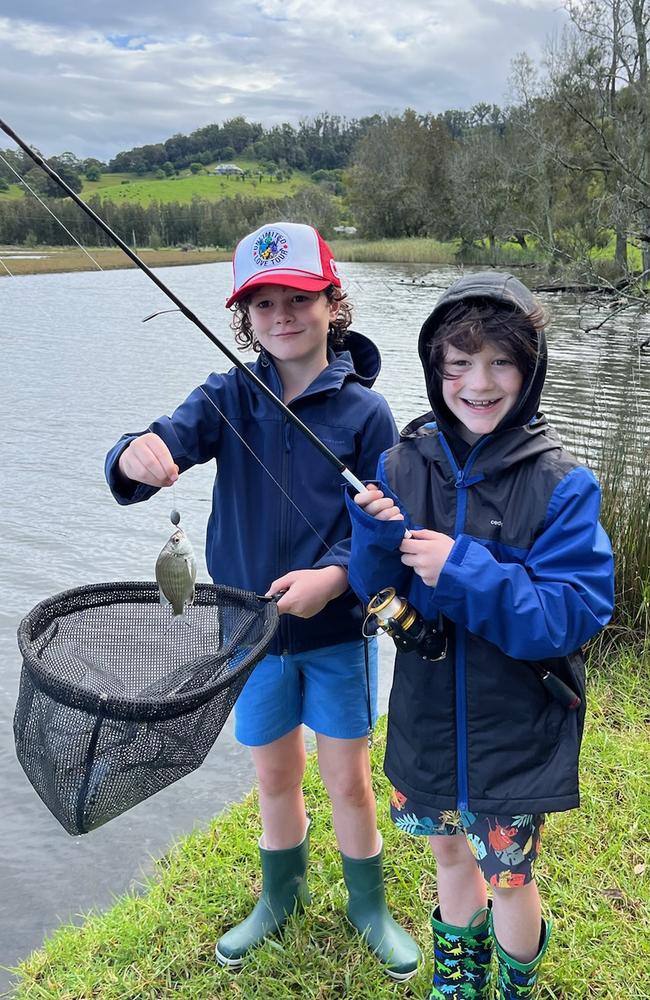 The family released this picture of the boys happily fishing together.