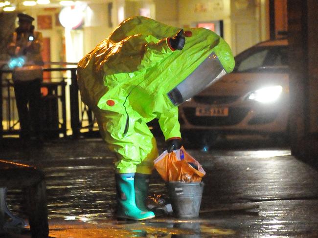 Suited-up officers collect evidence outside the Maltings shopping centre in Salisbury where the deadly nerve gas attack took place. Picture: Salisbury Journal/Solent News.