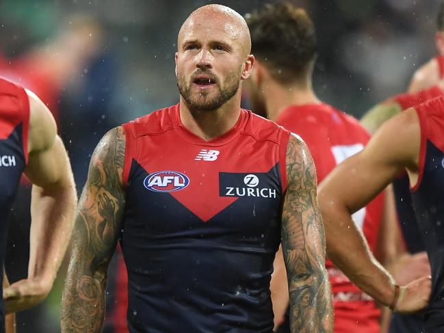 Nathan Jones of the Demons (centre) leads the players from field after the Round 2 AFL match between the Geelong Cats and the Melbourne Demons at GMHBA Stadium in Geelong, Saturday, March 30, 2019. (AAP Image/Julian Smith) NO ARCHIVING, EDITORIAL USE ONLY