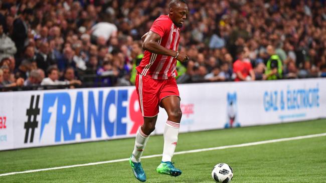 Usain Bolt during a legends game between France 98 and FIFA 98 in Nanterre, France, in June. Picture: Getty Images