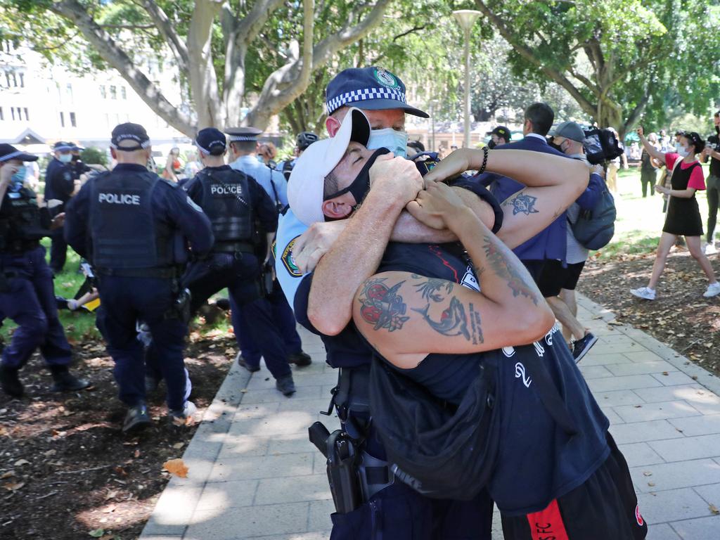 Pictured is police arresting a protester during an unauthorised march following an organised Australia Day protest at The Domain in Sydney. Picture: Richard Dobson