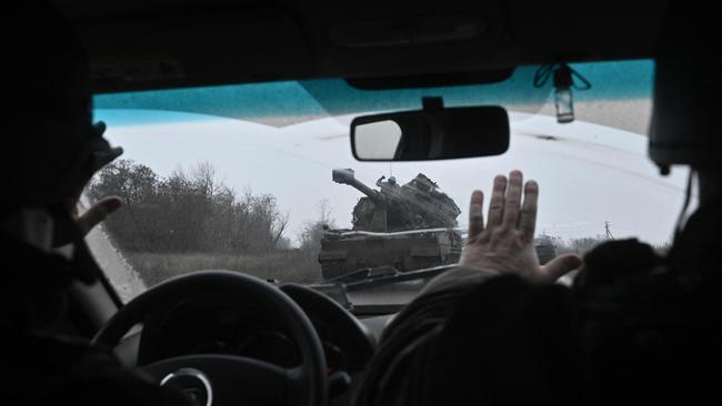 Ukrainian servicemen drive a self-propelled howitzer 'AHS Krab' in eastern Ukraine.