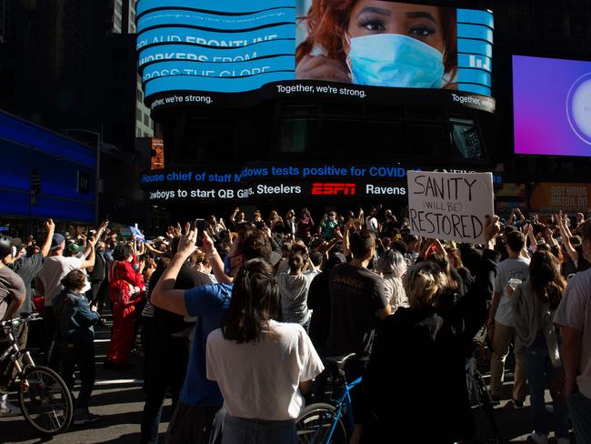 People celebrate at Times Square in New York after Joe Biden was declared winner of the 2020 presidential election. Picture: AFP