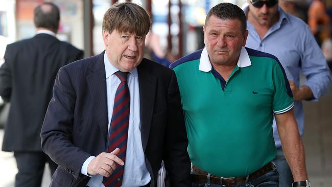 Lawyer and Adelaide United chairman Greg Griffin, left, arriving at Coombs Barei Constructions meeting earlier this month with client Mario Colangelo whose concreting firm is owed $74,000. Picture: Calum Robertson