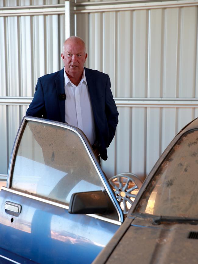 Ex detective and cold case specialist Damian Loone looking at Rachelle's Commodore. Picture: Jeff Darmanin