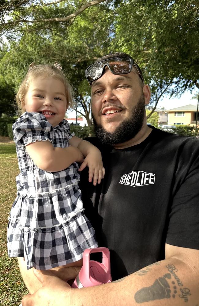 Mackay dad Kody Monks, pictured with daughter Bonnie, 2, is still in a coma three days after he was seriously injured during a race at the Sarina Mud Trials on Saturday, May 4, 2024. Picture: Contributed