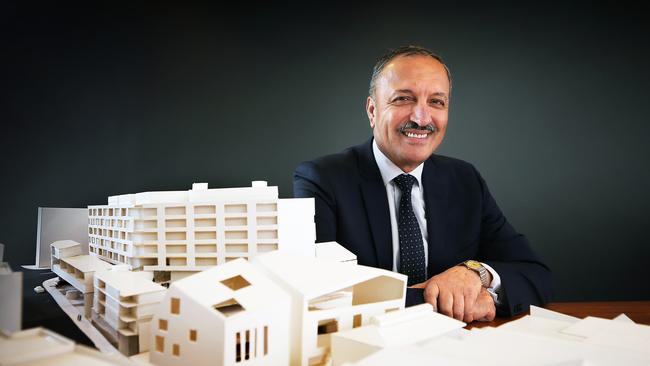 Ali Sultan just before he put in the application for his Montpelier Retreat development, with a scale model of the buildings.