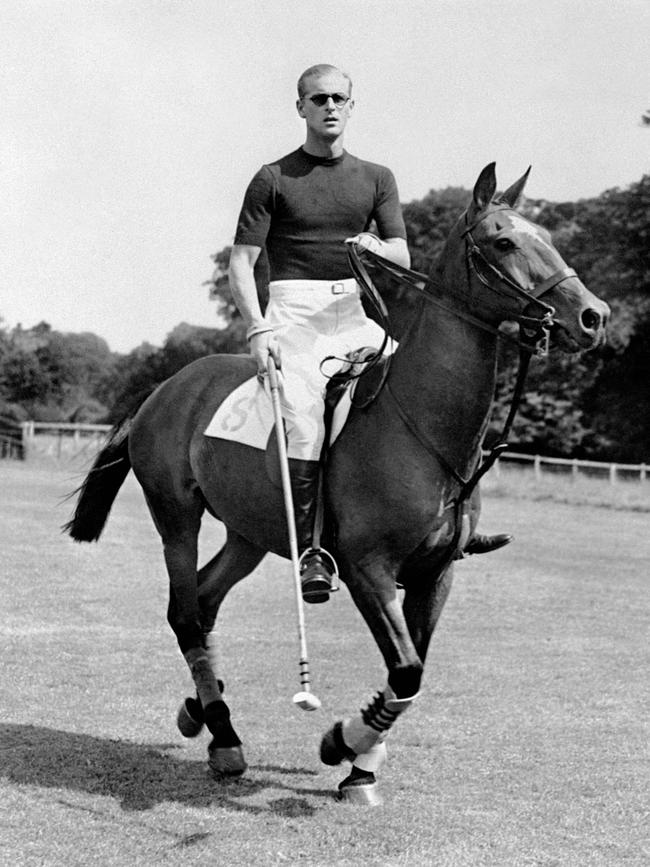 Philip plays polo in England in August 1950 a few days before the birth of second child Anne. Picture: AFP