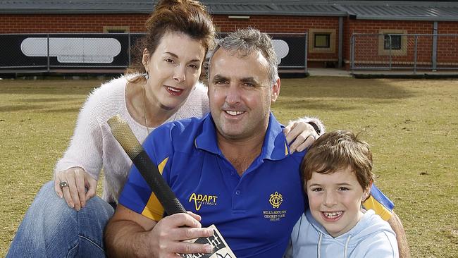 Craig Sheedy of Essendon has retired from cricket after a decorated 30-year career at Essendon, Carlton and Williamstown. Craig with his wife Sharon and son Cooper, 9, at Windy Hill stadium, Picture Yuri KOuzmin