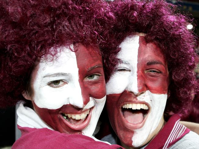 Suncorp Stadium, Qld vs NSW for the second game in the State of Origin series, Maroons Fans with painted faces and wearing wigs l-r Stacey Clayton 18yrs and Rachael Scuderi 18yrs from Bris.