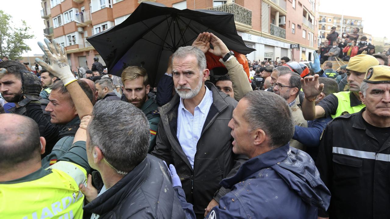 Extra security was quickly brought in to help protect King Felipe during the tense exchange with some of those directly impacted by the floods. Picture: AP Photo/Hugo Torres